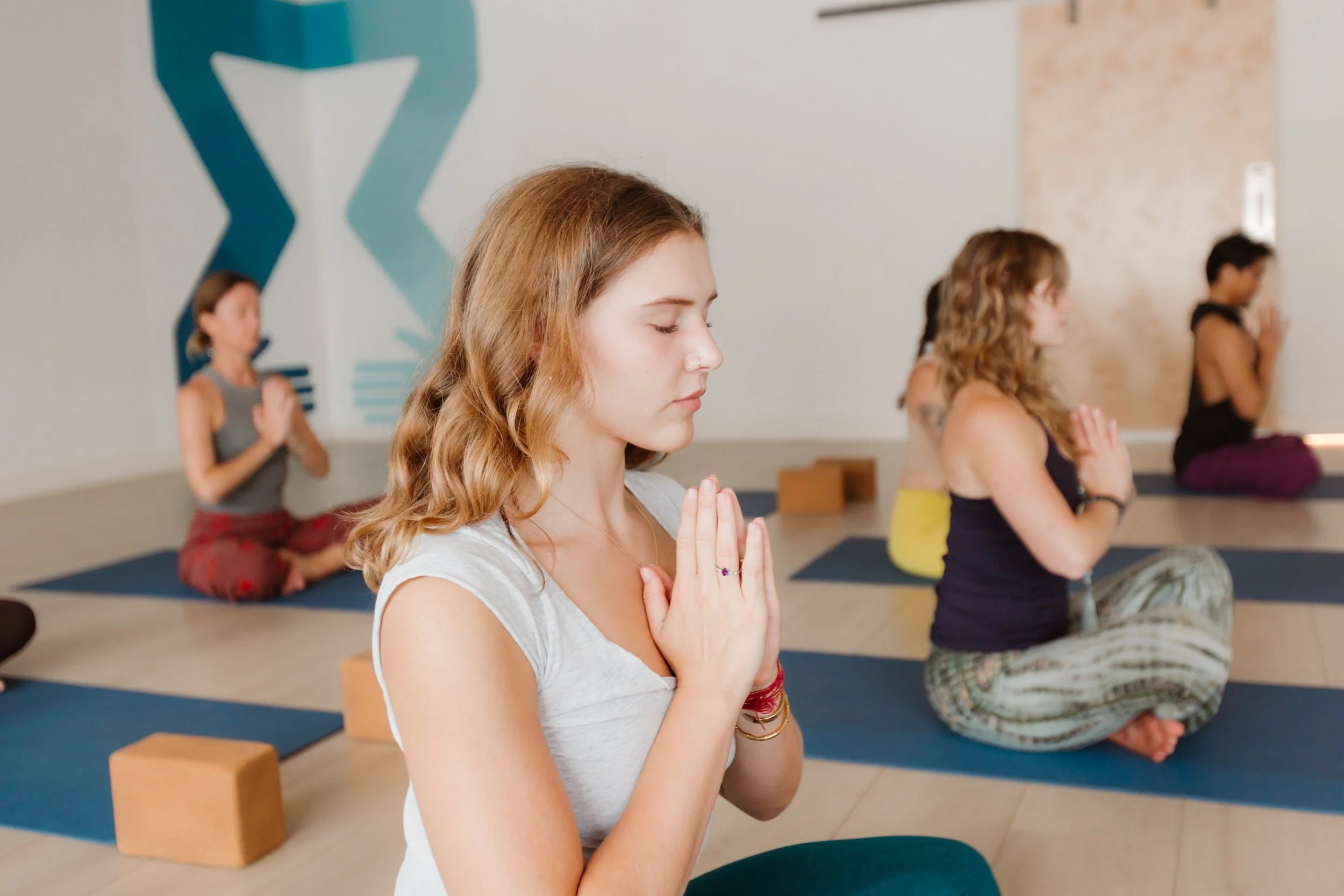 People practicing yoga inside Union’s studio